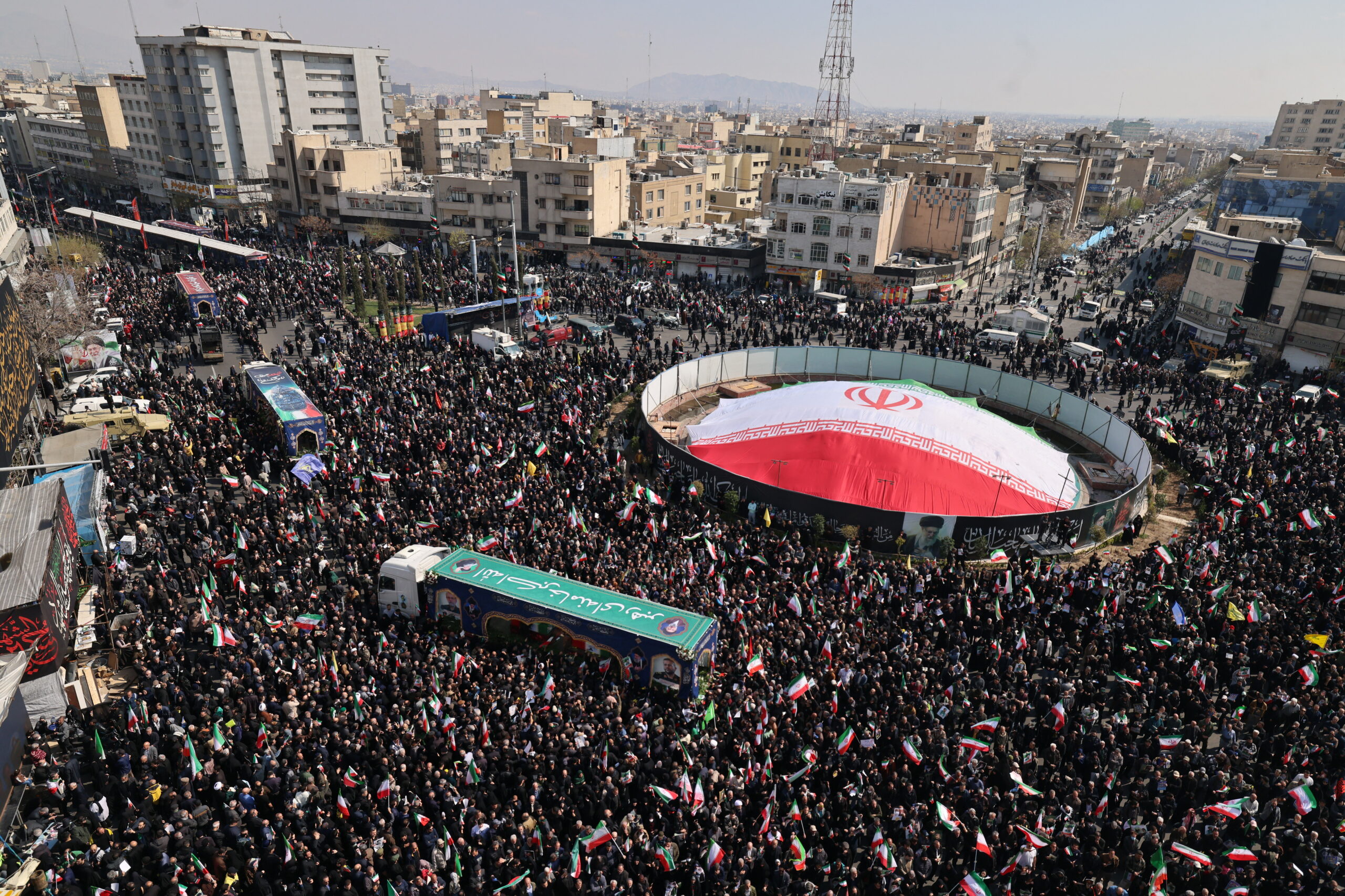 TOPSHOT - Iranian mourners gather during the funeral of Iran's security chief Ali Larijani and Gholamreza Soleimani, a senior officer in the Islamic Revolutionary Guard Corps who commands Basij forces, in Tehran on March 18, 2026. After crowds gathered in central Tehran for the funeral of Iran's security chief Ali Larijani, Iran's new supreme leader Mojtaba Khamenei declared in a written message that his killers would pay. Larijani's funeral was held alongside those of Gholamreza Soleimani, the head of the Basij paramilitary force who was also killed in a strike in Iran this week, and dozens of Iranian sailors who were killed when US forces torpedoed their frigate off Sri Lanka earlier this month. (Photo by ATTA KENARE / AFP via Getty Images) /