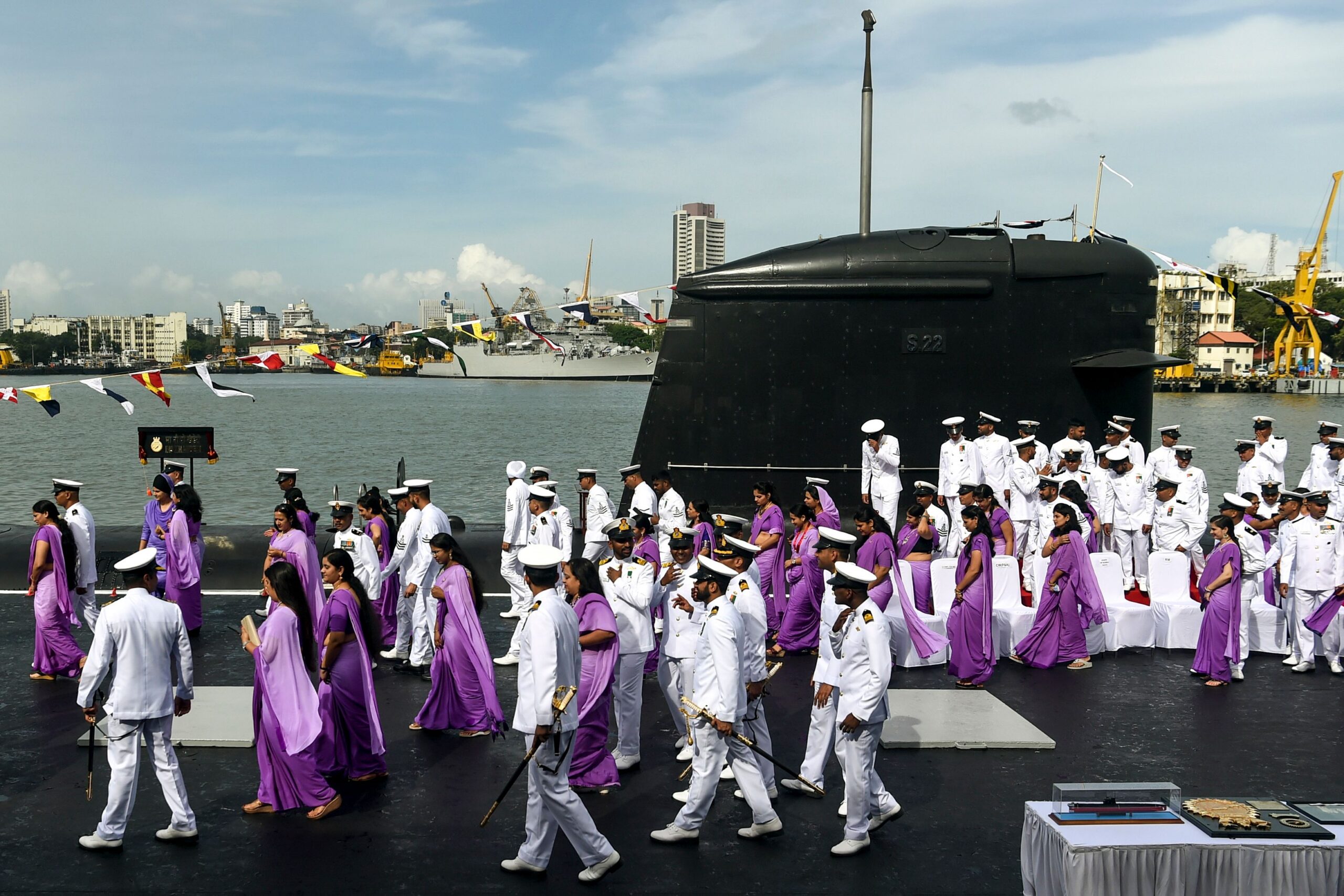 TOPSHOT - The crew of 'INS Khanderi', the second submarine of Project 75 (Yard 11876), leave after posing for a photograph with their family members during its commissioning ceremony into the Indian Navy at Mumbai naval base on September 28, 2019. (Photo by PUNIT PARANJPE / AFP) (Photo by PUNIT PARANJPE/AFP via Getty Images)