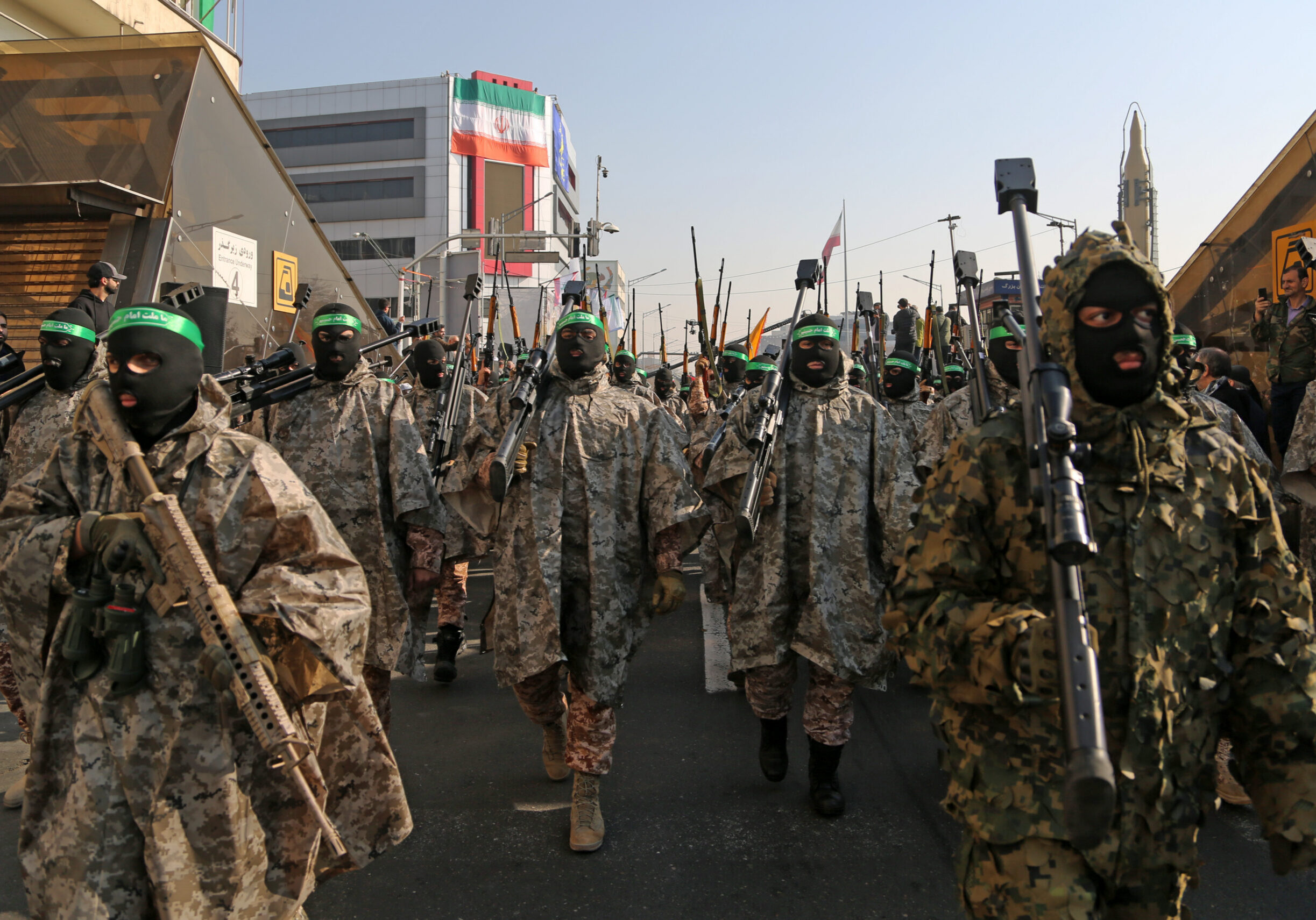 TEHRAN, IRAN - JANUARY 10: Hundreds of Iraninan carrying banners take part in a demonstration against Israel and the United States as they march through Enghelab Street in capital city Tehran, Iran on January 10, 2025. A march was organized by the Revolutionary Guards and Basij, the militia of the Islamic Revolutionary Guards Corps (IRGC). Thousands of men and women who identify themselves as 'Basij Volunteers' marched in the parade. Carrying Palestinian and Iranian flags, the group chanted slogans against Israel and the United States. (Photo by Fatemeh Bahrami/Anadolu via Getty Images)