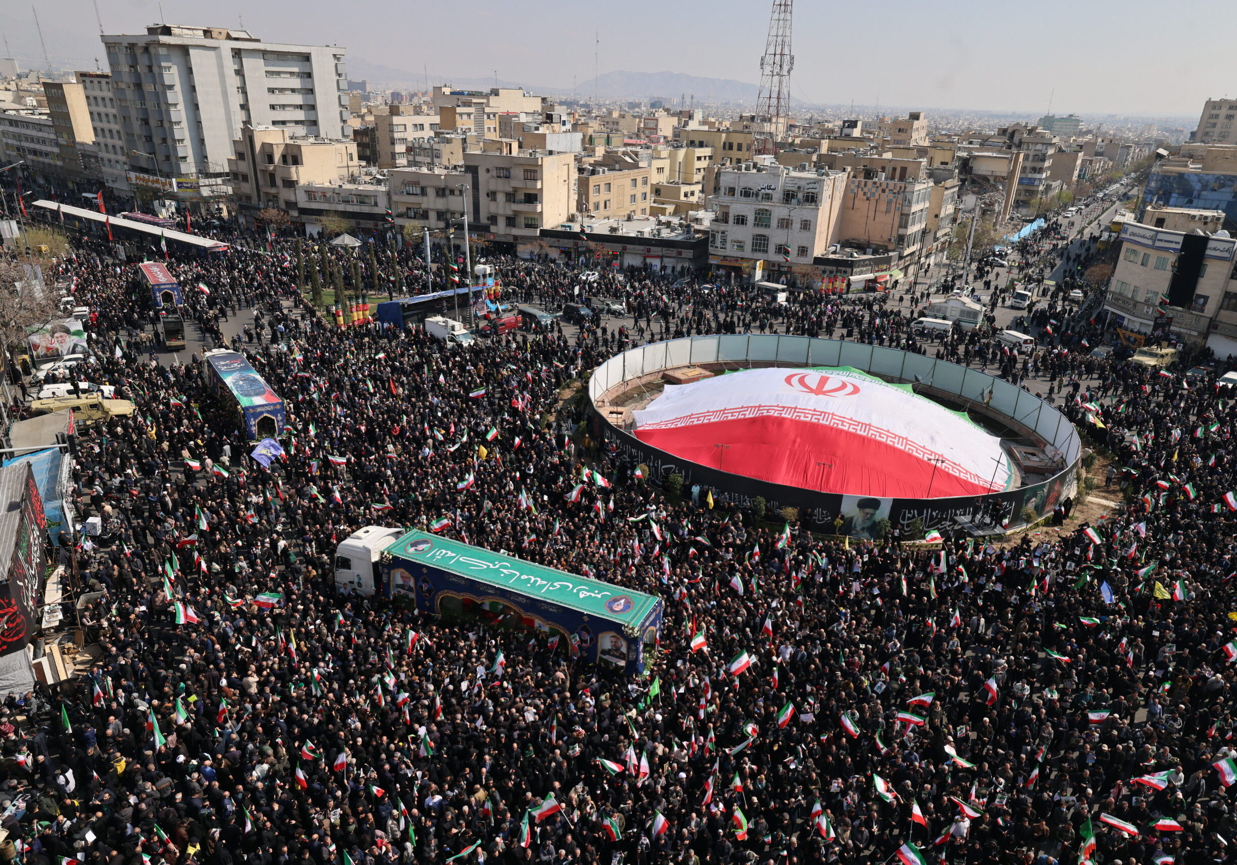 TOPSHOT - Iranian mourners gather during the funeral of Iran's security chief Ali Larijani and Gholamreza Soleimani, a senior officer in the Islamic Revolutionary Guard Corps who commands Basij forces, in Tehran on March 18, 2026. After crowds gathered in central Tehran for the funeral of Iran's security chief Ali Larijani, Iran's new supreme leader Mojtaba Khamenei declared in a written message that his killers would pay. Larijani's funeral was held alongside those of Gholamreza Soleimani, the head of the Basij paramilitary force who was also killed in a strike in Iran this week, and dozens of Iranian sailors who were killed when US forces torpedoed their frigate off Sri Lanka earlier this month. (Photo by ATTA KENARE / AFP via Getty Images) /